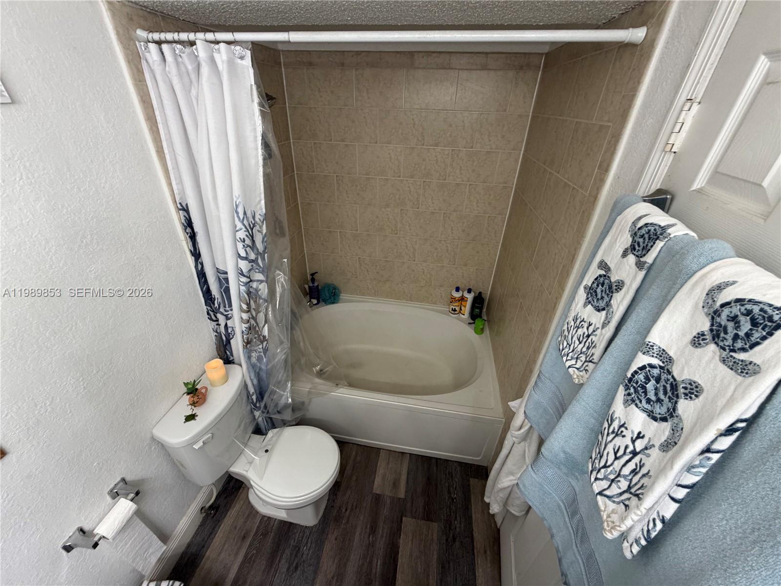 10670 Southwest 156th Place, Unit 308 Miami, FL 33196 - Photo 7 of 21 a bathroom with a sink toilet and shower