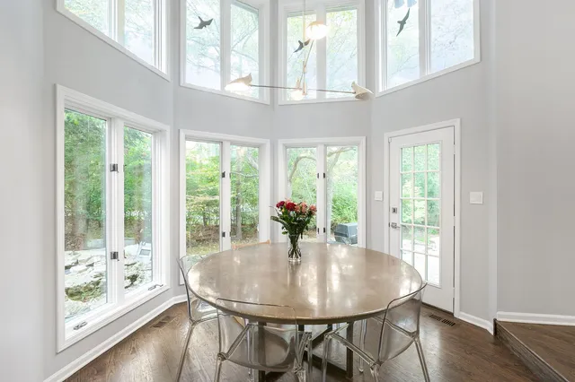a view of a dining room with furniture window and wooden floor