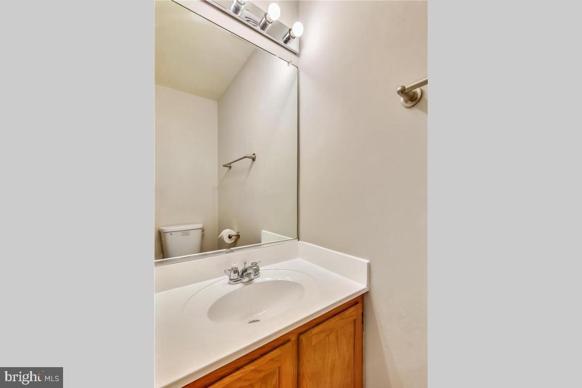 106 Princetown Drive, Unit 5B Frederick, MD 21702 - Photo 13 of 38 a bathroom with a sink and a mirror