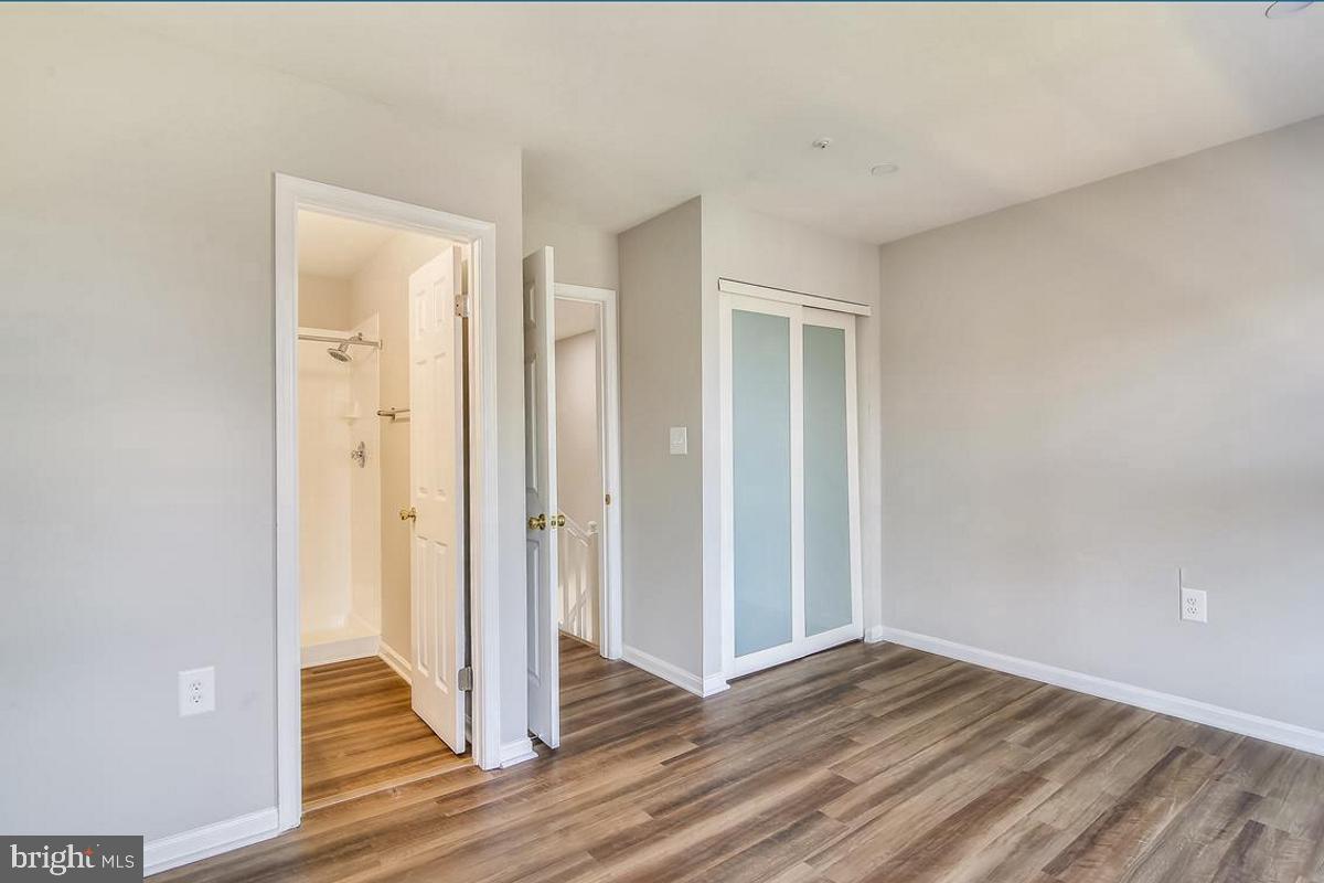 106 Princetown Drive, Unit 5B Frederick, MD 21702 - Photo 15 of 38 a view of a livingroom with wooden floor and entryway