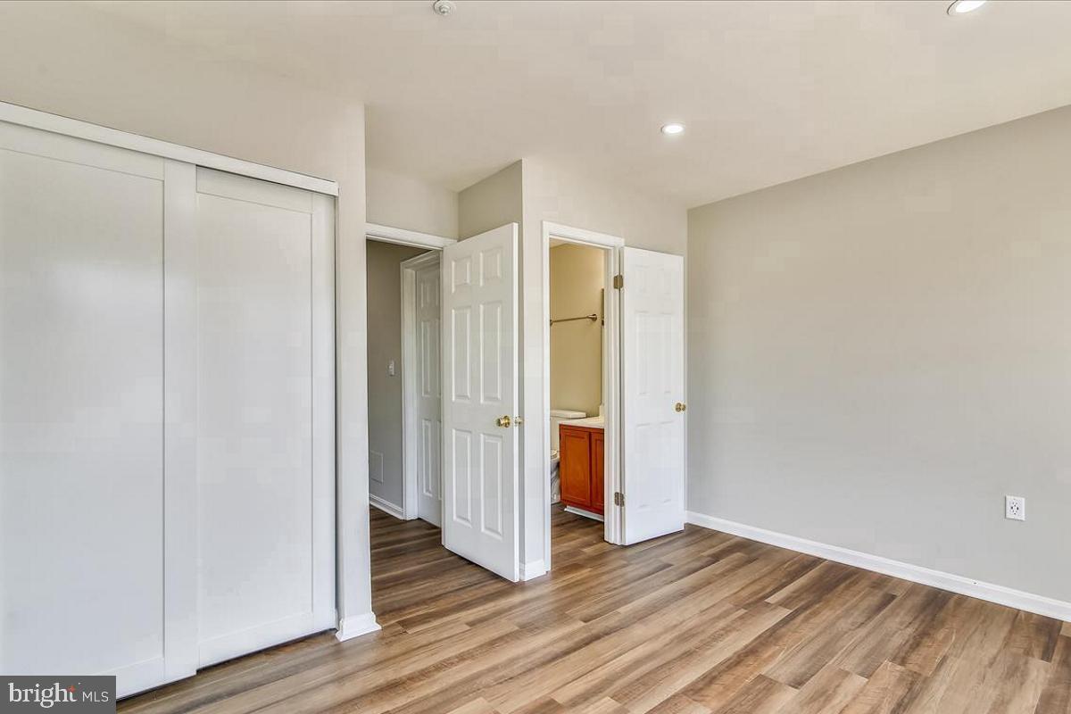 106 Princetown Drive, Unit 5B Frederick, MD 21702 - Photo 16 of 38 a view of empty room with wooden floor