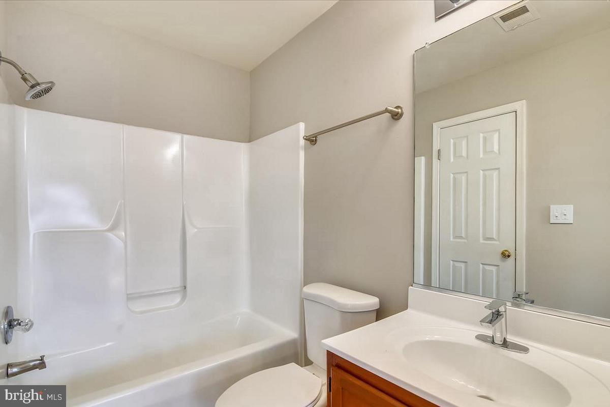 106 Princetown Drive, Unit 5B Frederick, MD 21702 - Photo 17 of 38 a bathroom with a sink toilet and shower