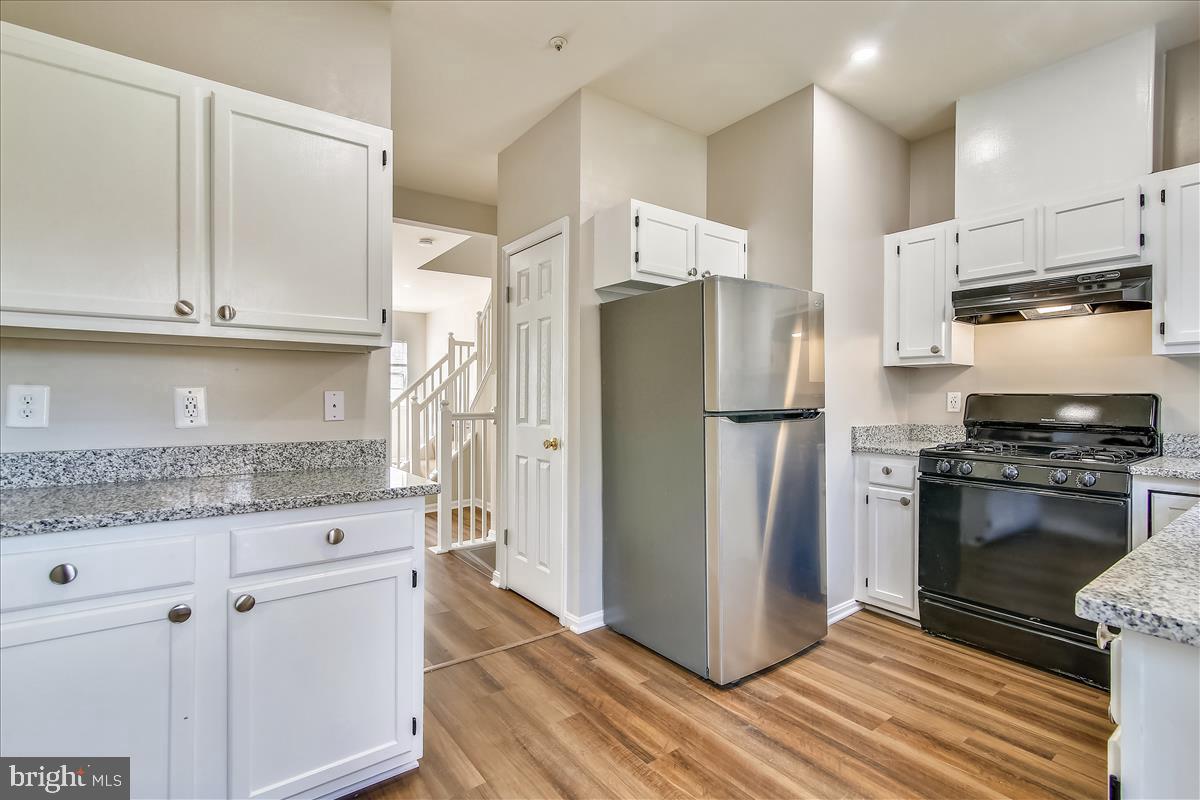 106 Princetown Drive, Unit 5B Frederick, MD 21702 - Photo 2 of 38 a kitchen with stainless steel appliances granite countertop a refrigerator and a stove
