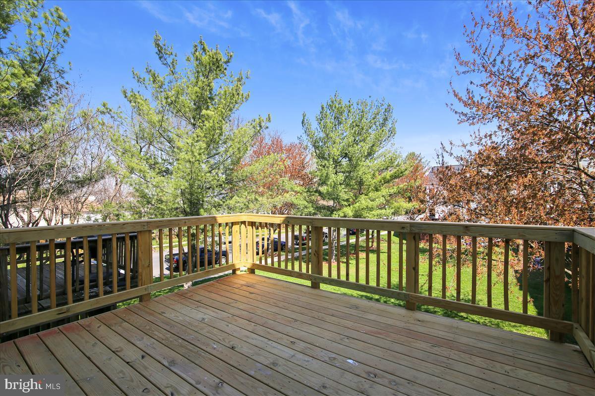 106 Princetown Drive, Unit 5B Frederick, MD 21702 - Photo 21 of 38 a view of balcony with wooden floor and fence