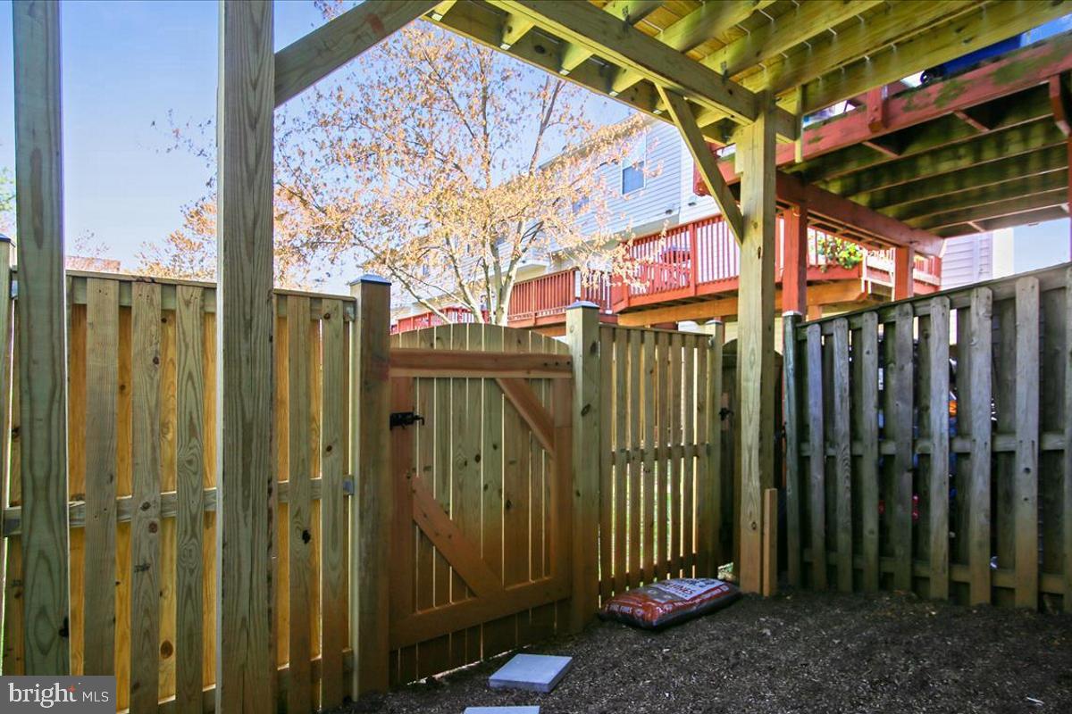 106 Princetown Drive, Unit 5B Frederick, MD 21702 - Photo 23 of 38 a view of a house with a backyard