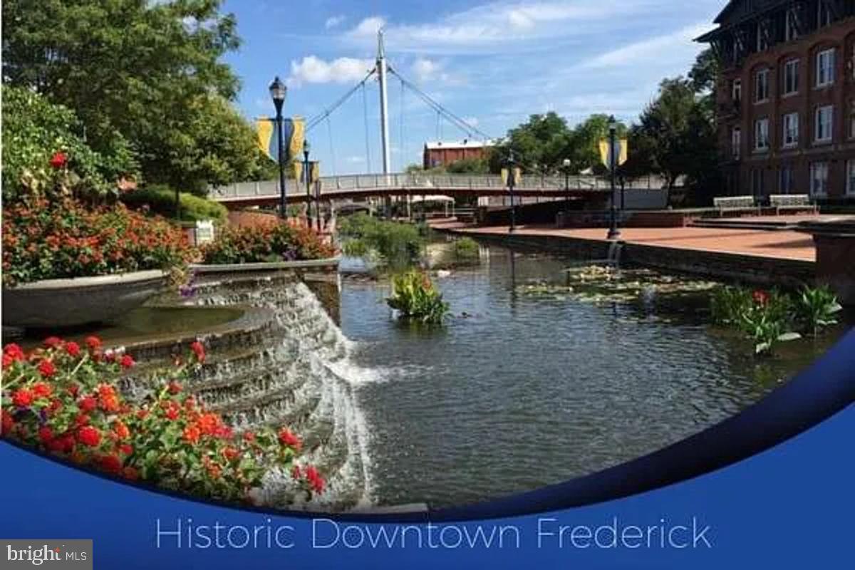 106 Princetown Drive, Unit 5B Frederick, MD 21702 - Photo 27 of 38 a view of a lake with a house
