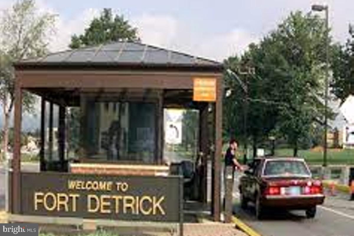 106 Princetown Drive, Unit 5B Frederick, MD 21702 - Photo 31 of 38 a view of a car parked in front of a building