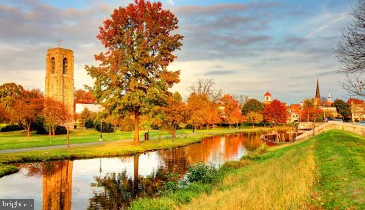 106 Princetown Drive, Unit 5B Frederick, MD 21702 - Photo 35 of 38 a view of a lake with a trees in the background