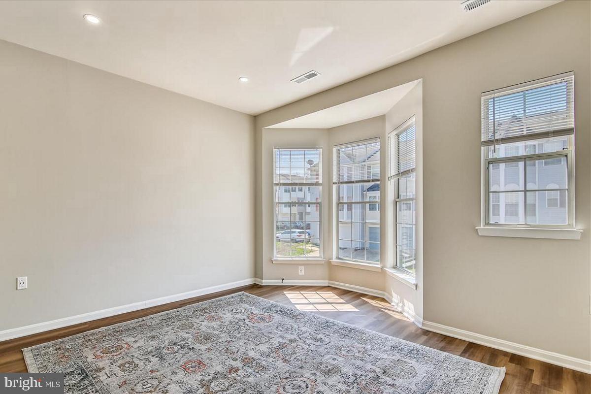 106 Princetown Drive, Unit 5B Frederick, MD 21702 - Photo 7 of 38 a view of an empty room with a window