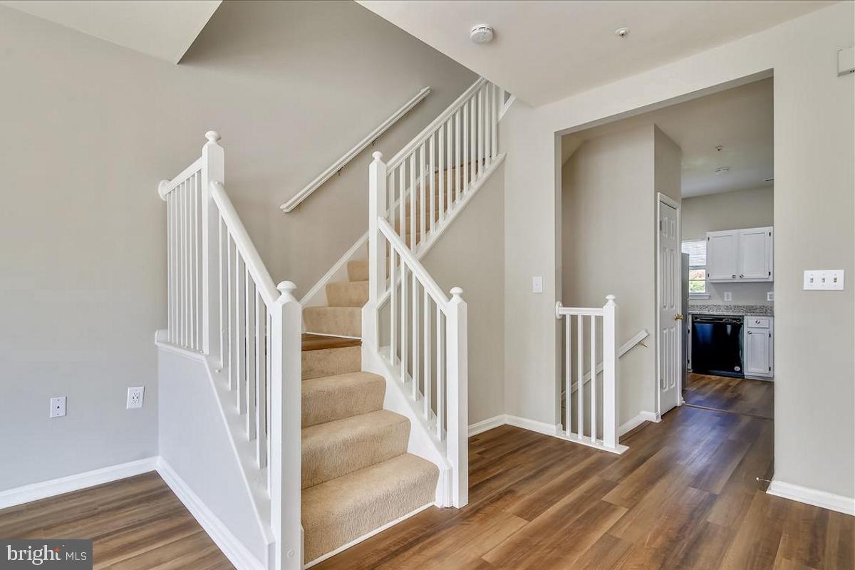 106 Princetown Drive, Unit 5B Frederick, MD 21702 - Photo 10 of 38 a view of entryway and hall with wooden floor