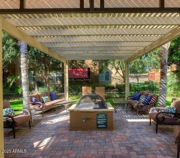 110 West Bell Road, Unit 1 Phoenix, AZ 85023 - Photo 17 of 19 a patio with table and chairs and potted plants
