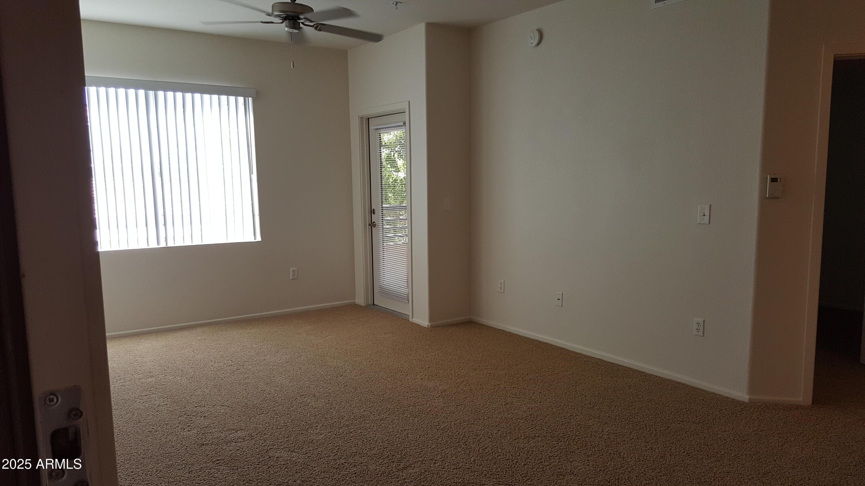 110 West Bell Road, Unit 1 Phoenix, AZ 85023 - Photo 3 of 19 an empty room with a window