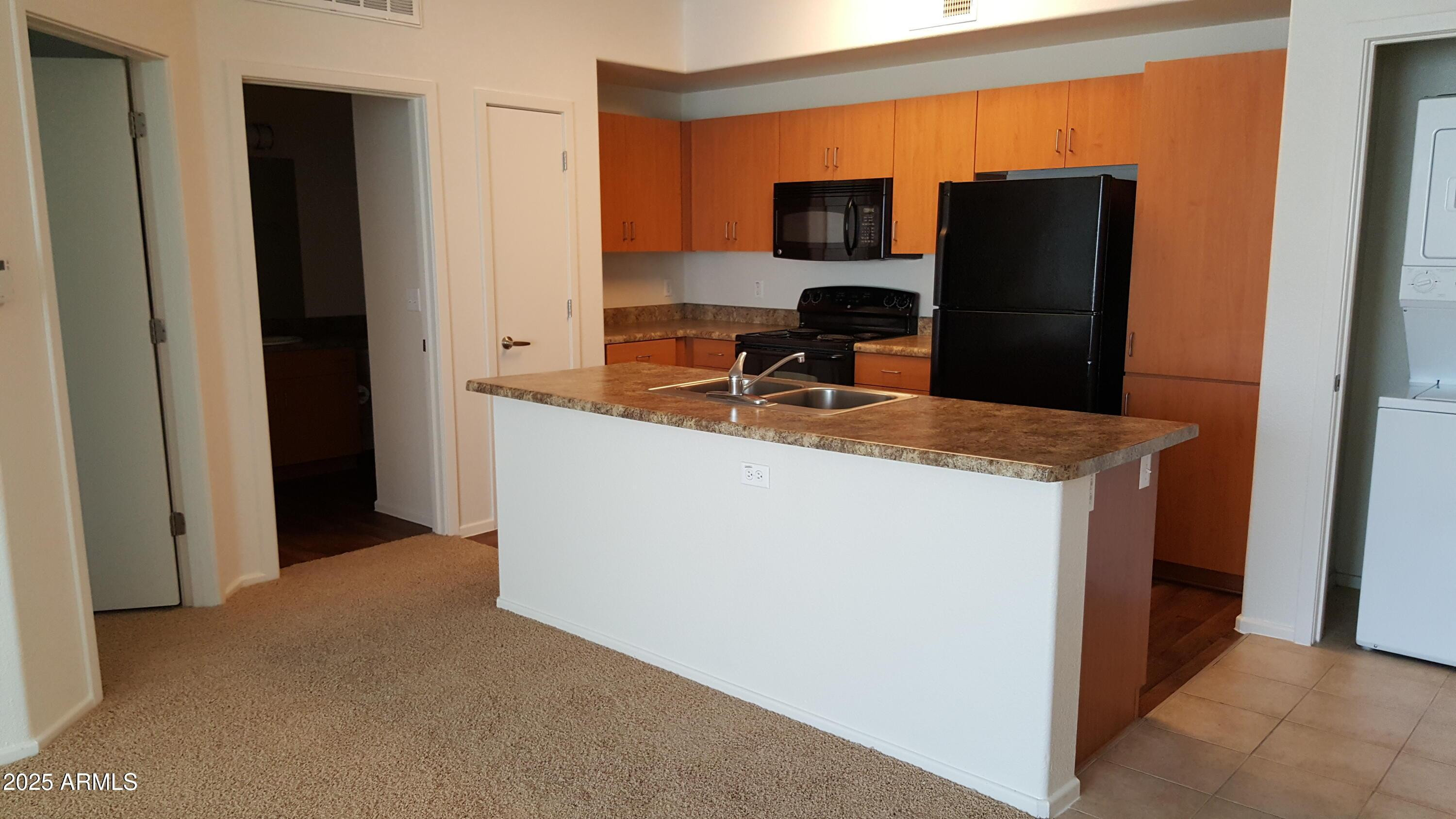 110 West Bell Road, Unit 1 Phoenix, AZ 85023 - Photo 5 of 19 a kitchen with refrigerator and sink