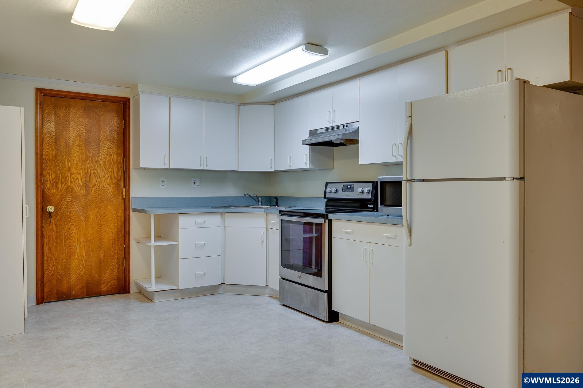 27572 South Kinzy Road Estacada, OR 97023 - Photo 36 of 50 a kitchen with stainless steel appliances a refrigerator sink and cabinets