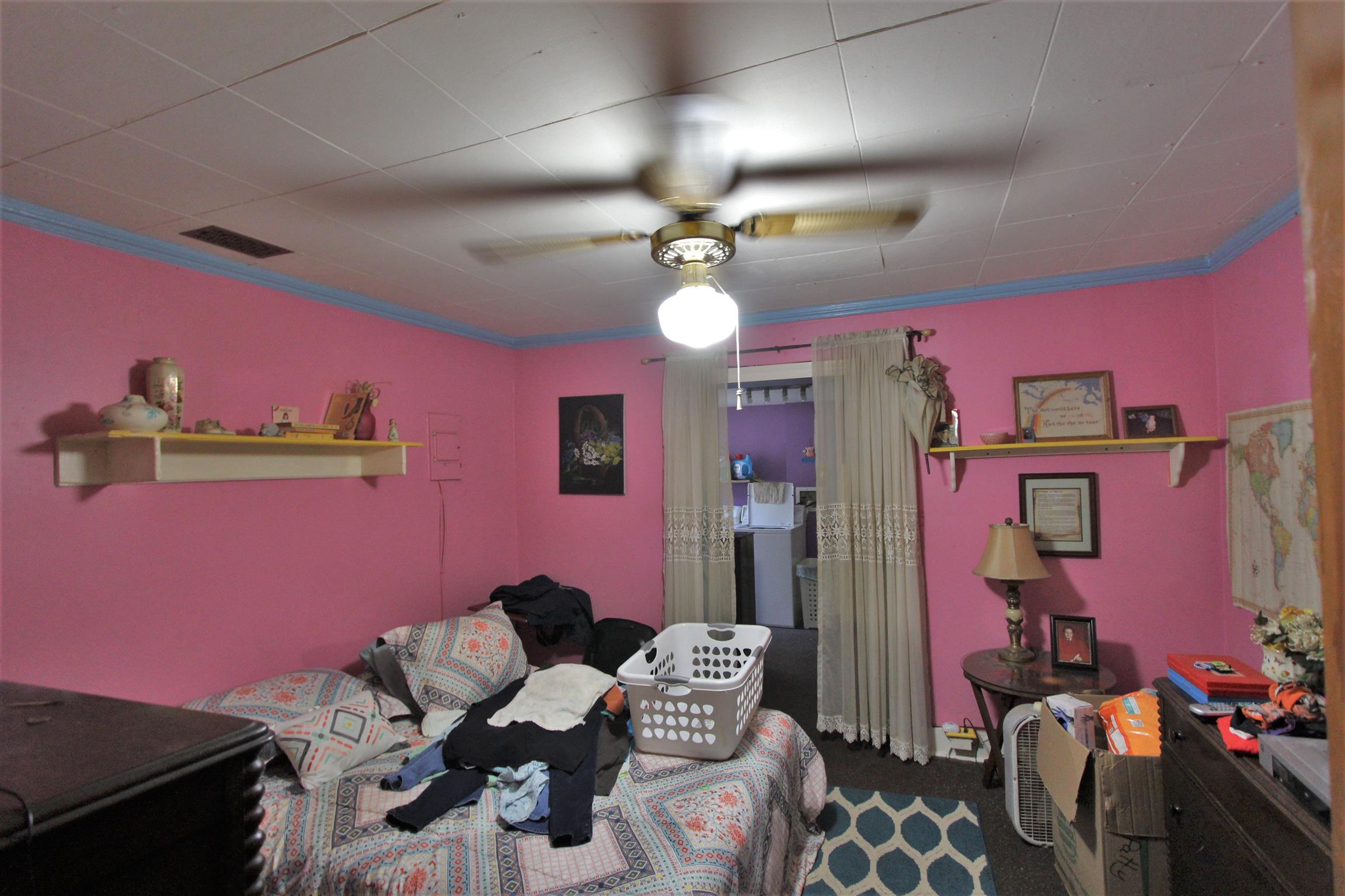 3530 Franklin Road Lebanon, TN 37090 - Photo 11 of 18 a bedroom with furniture and a chandelier