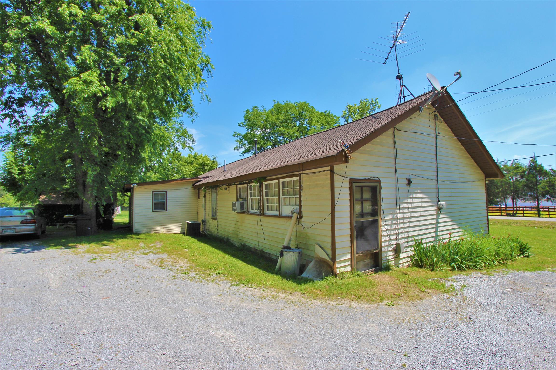 3530 Franklin Road Lebanon, TN 37090 - Photo 7 of 18 a view of a house with a yard and garage