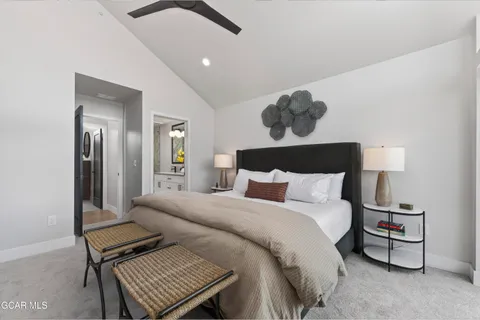 a bed sitting in a bedroom next to a window