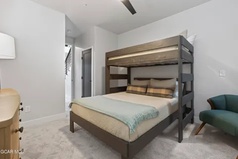 a bedroom with a bed and a dresser