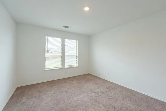 a bathroom with a sink mirror and toilet