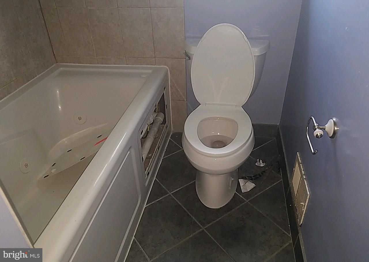4618 Ballygar Road Baltimore, MD 21236 - Photo 15 of 29 a close view of a toilet in a bathroom