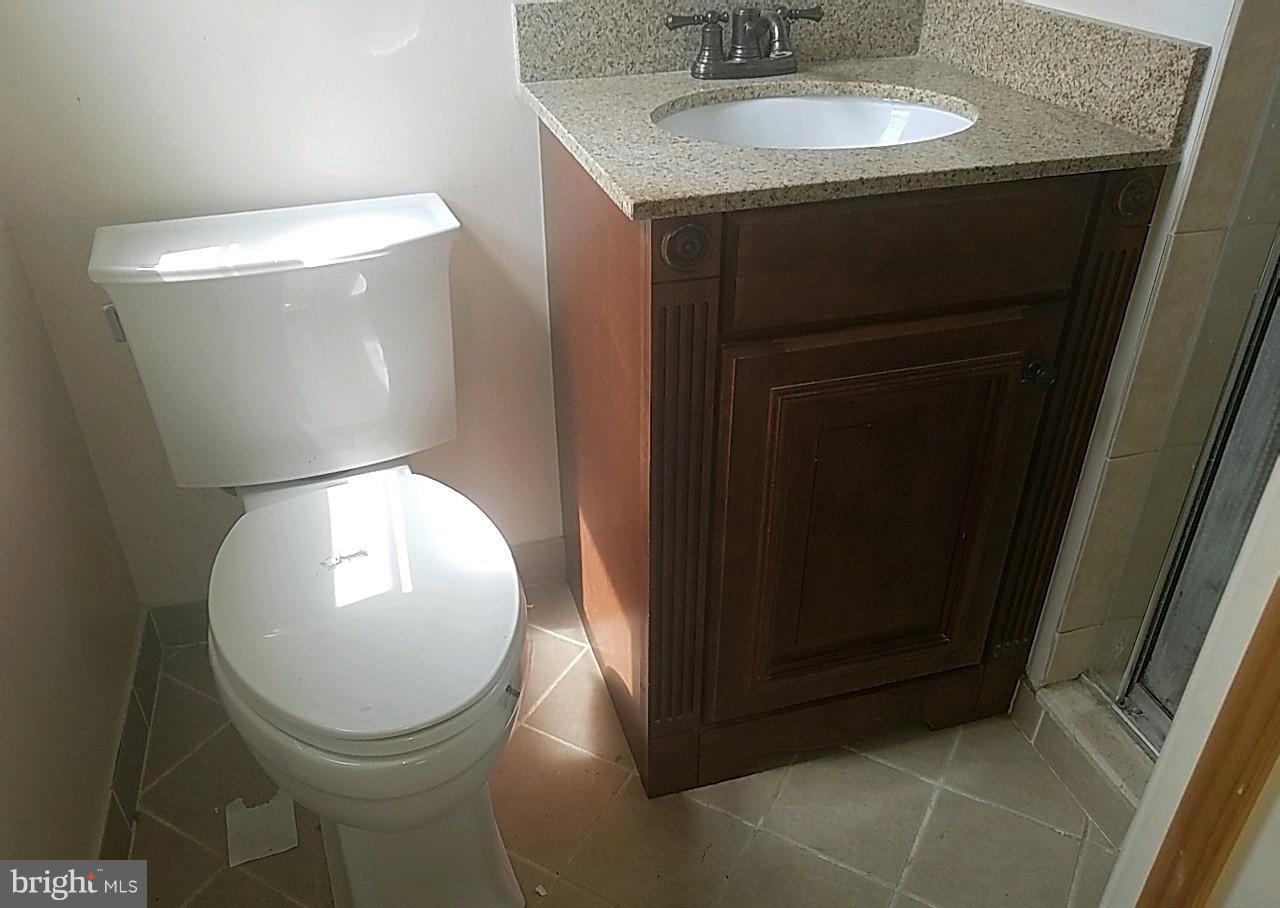 4618 Ballygar Road Baltimore, MD 21236 - Photo 20 of 29 a bathroom with a toilet and a sink