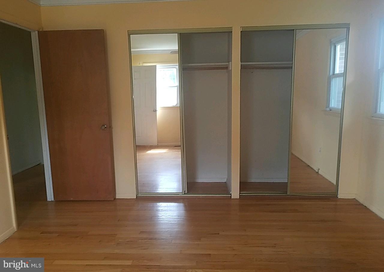 4618 Ballygar Road Baltimore, MD 21236 - Photo 22 of 29 a view of empty room with wooden floor