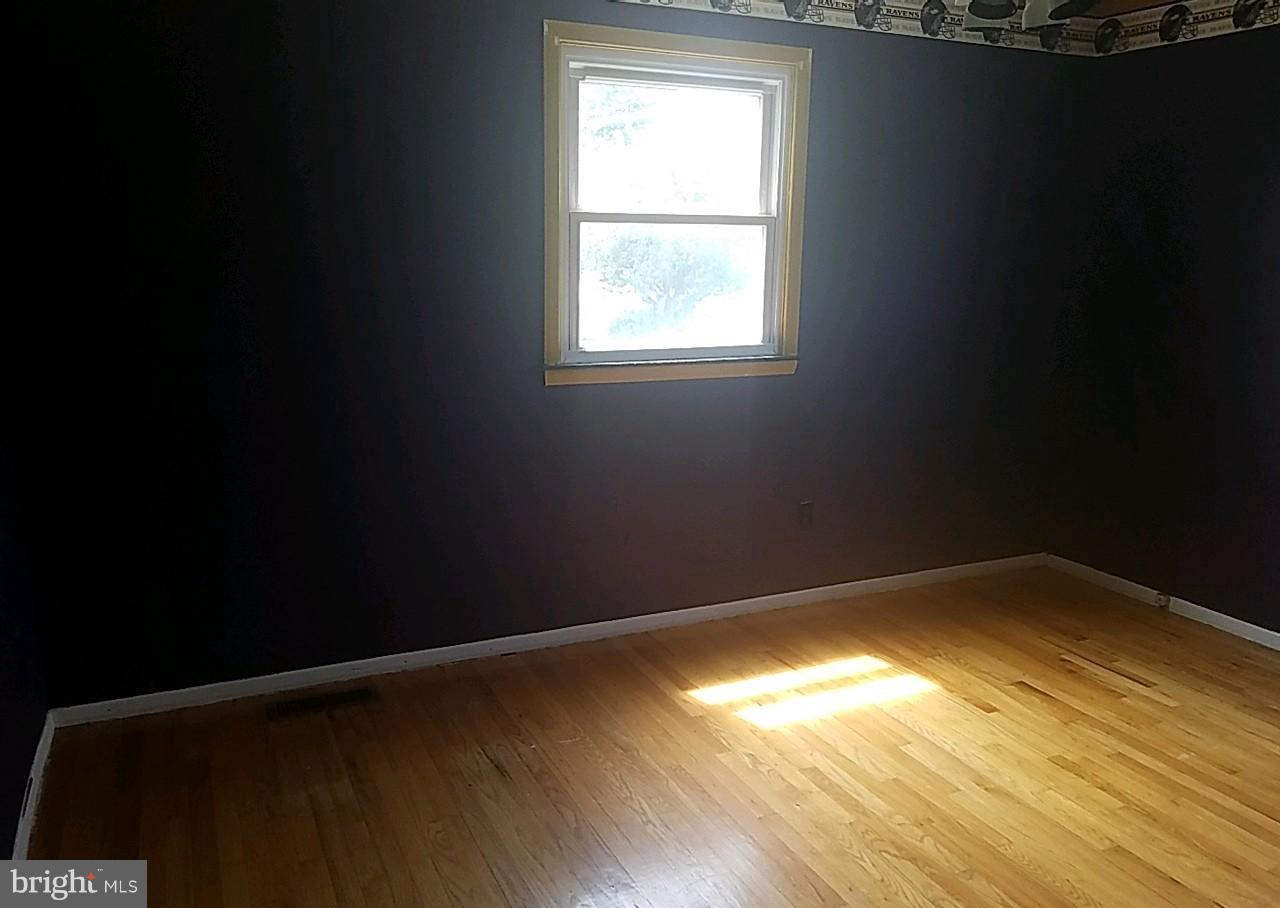 4618 Ballygar Road Baltimore, MD 21236 - Photo 24 of 29 a view of empty room with wooden floor