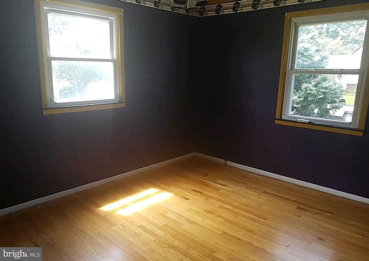 4618 Ballygar Road Baltimore, MD 21236 - Photo 25 of 29 a view of empty room with wooden floor