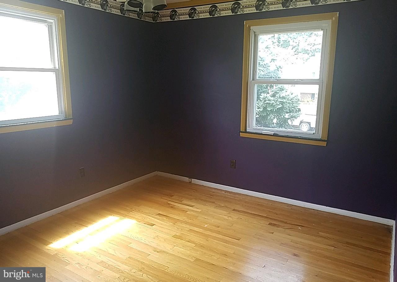 4618 Ballygar Road Baltimore, MD 21236 - Photo 26 of 29 a view of empty room with wooden floor