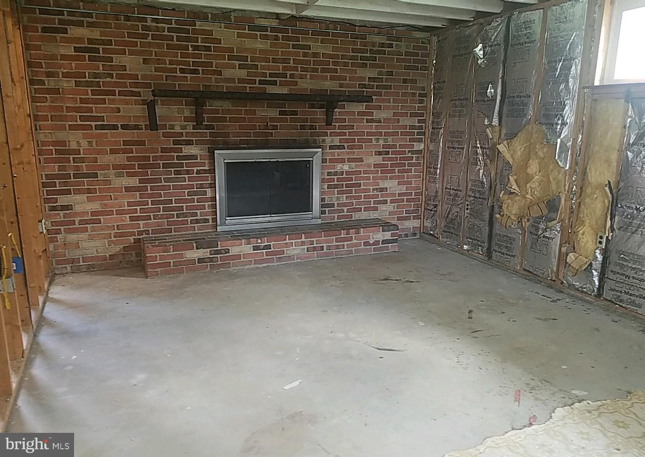 4618 Ballygar Road Baltimore, MD 21236 - Photo 27 of 29 a view of empty room with a fireplace