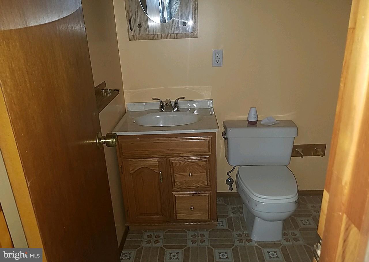 4618 Ballygar Road Baltimore, MD 21236 - Photo 28 of 29 a bathroom with a toilet and a sink