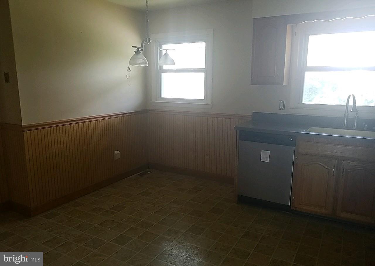 4618 Ballygar Road Baltimore, MD 21236 - Photo 6 of 29 an empty room with windows