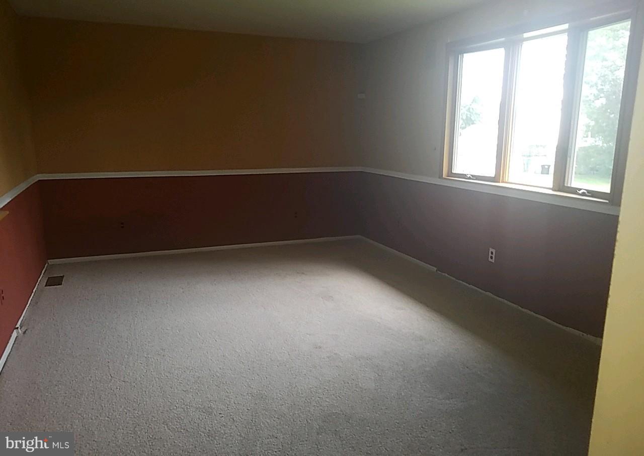 4618 Ballygar Road Baltimore, MD 21236 - Photo 9 of 29 an empty room with a window