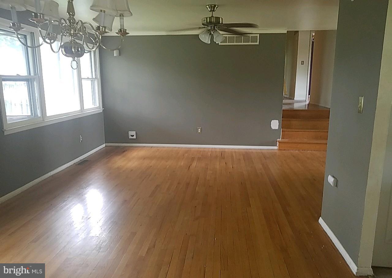 4618 Ballygar Road Baltimore, MD 21236 - Photo 10 of 29 an empty room with wooden floor windows and entrance