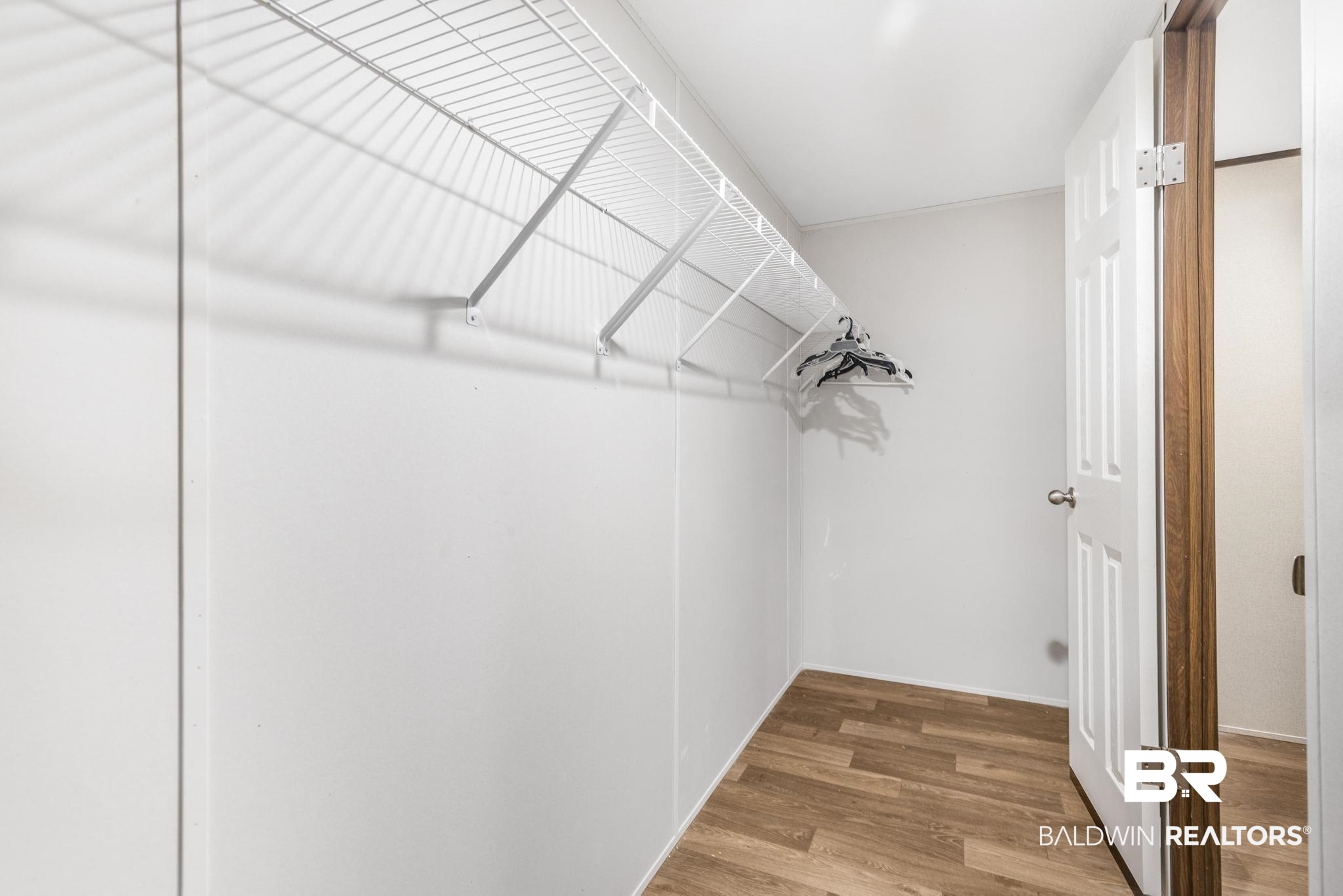 54309 Klasnich Road Perdido, AL 36562 - Photo 24 of 29 Spacious closet with wood finished floors