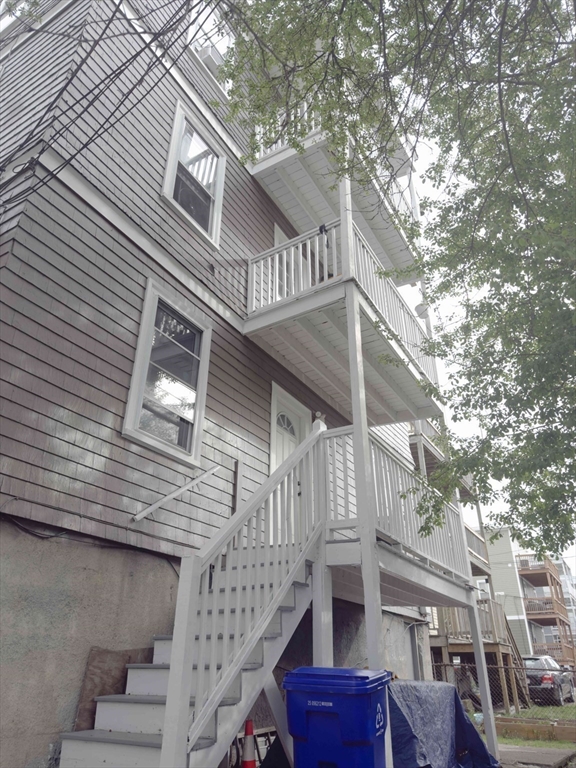 3965 Washington Street Boston, MA 02131 - Photo 17 of 18 a view of a house with a tree