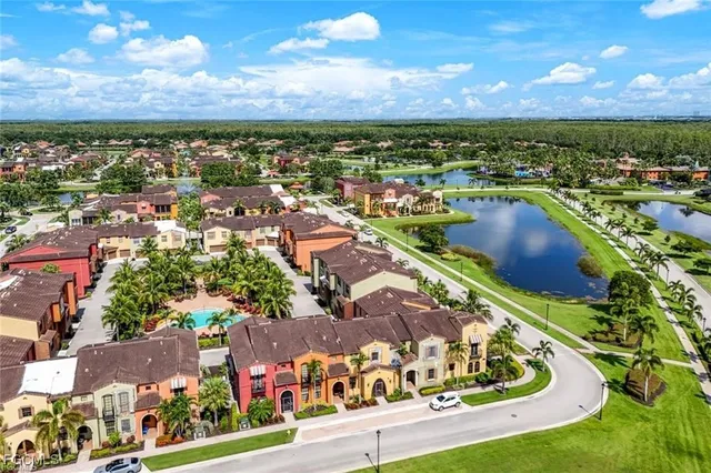 an aerial view of residential houses and outdoor space