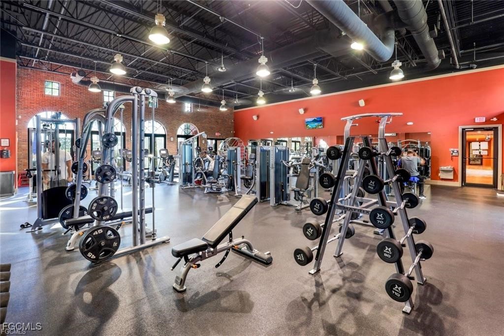 11758 Izarra Way, Unit 7703 Fort Myers, FL 33912 - Photo 30 of 37 a view of a room with gym equipment