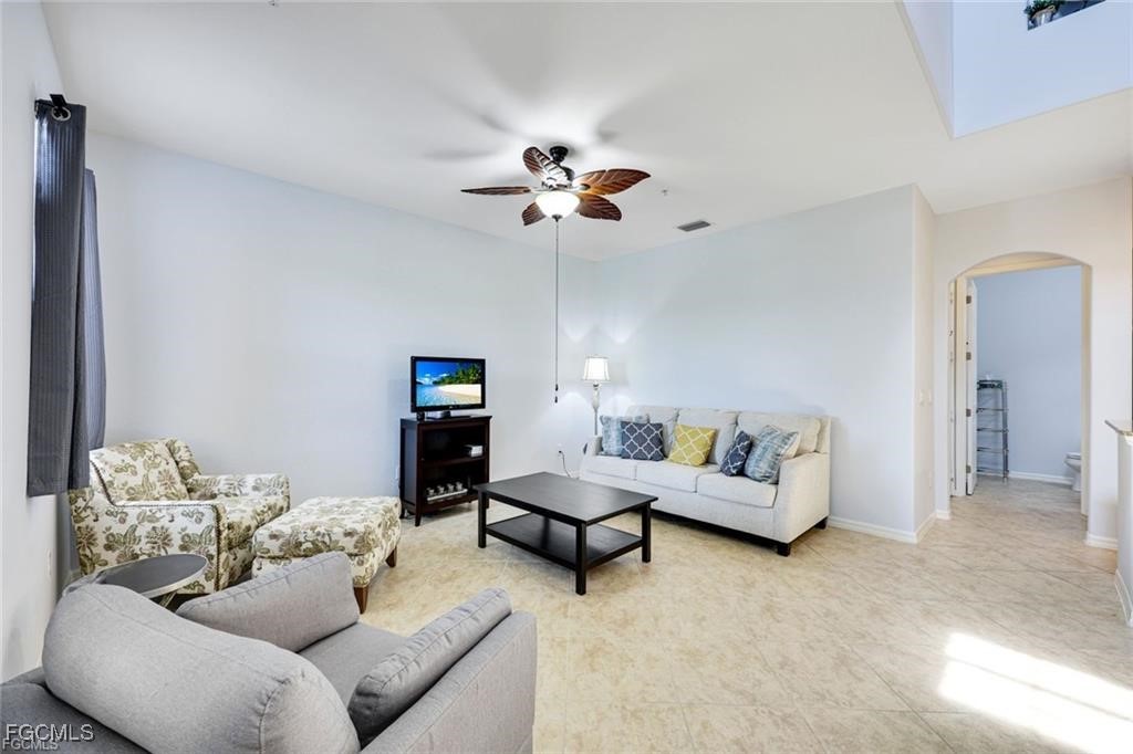 11758 Izarra Way, Unit 7703 Fort Myers, FL 33912 - Photo 4 of 37 a living room with furniture
