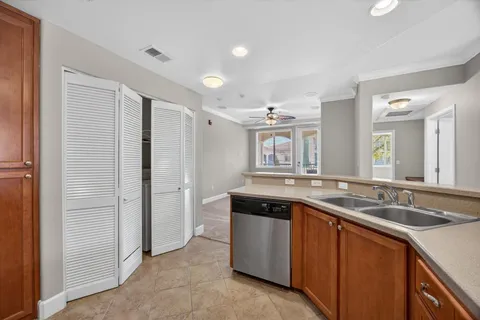 a kitchen with a sink and a refrigerator