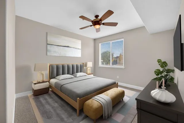 a bedroom with a bed and window