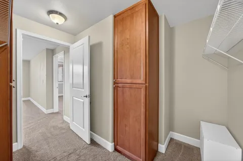 a bathroom with a tub shower and mirror