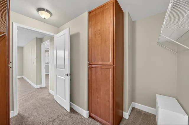 a bathroom with a tub shower and mirror