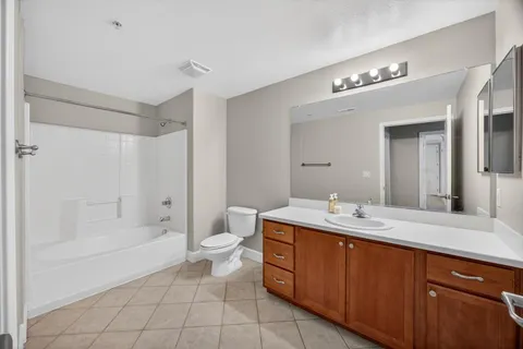 a bathroom with a sink a vanity and a mirror