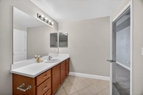 a view of a hallway to rooms