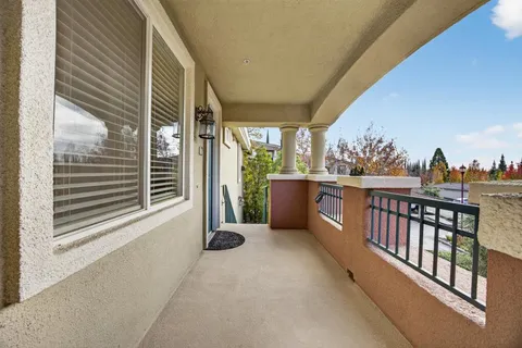 a view of a balcony with a sink and dishwasher