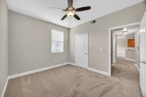 a view of a room with shelf on the wall