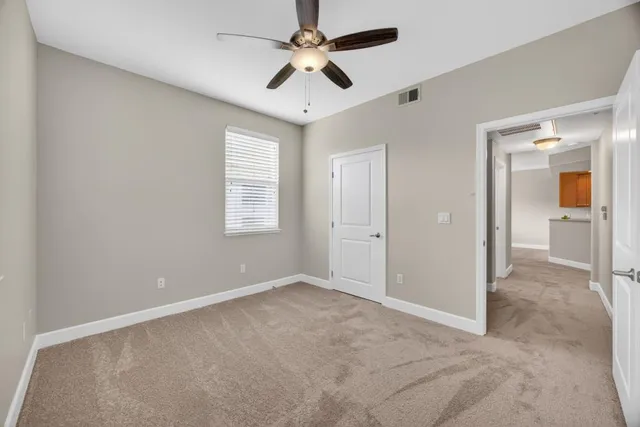 a view of a room with shelf on the wall