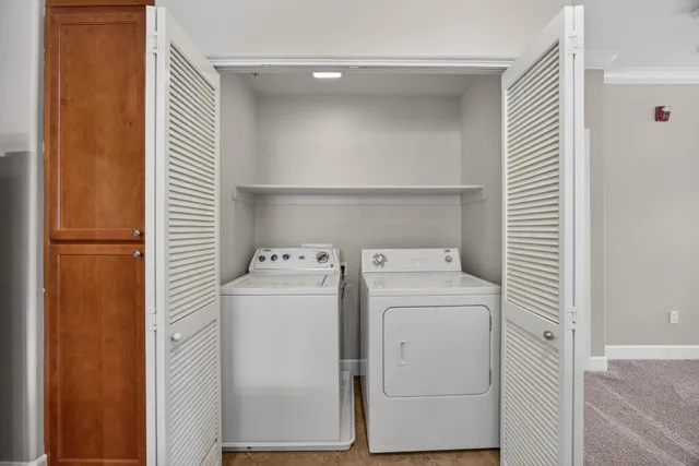 a view of a house with a yard and garage