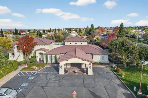 a table with wine bottles and glasses on it